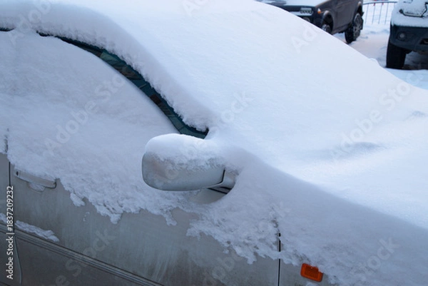 Fototapeta Starting a car in severe frost. Starting a car in the cold season, in winter.