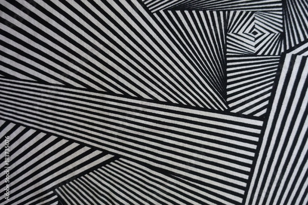 Fototapeta Non-symmetric geometric print on fabric from above