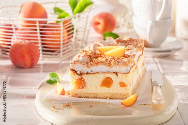 Obraz Delicious and tasty peach cheesecake freshly baked in the kitchen.