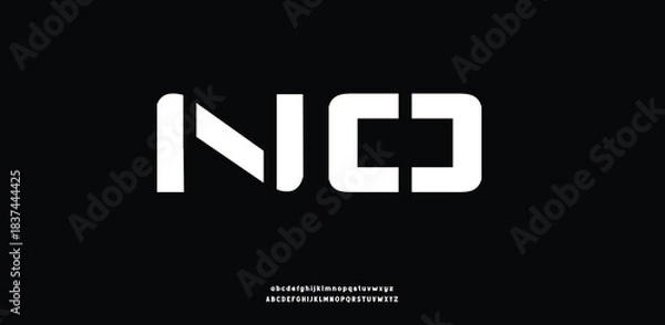 Obraz A futuristic, geometric block font with sharp cutouts and bold techno-inspired shapes.