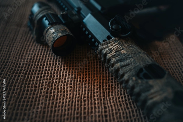 Obraz camouflaged rifle with a collimator sight