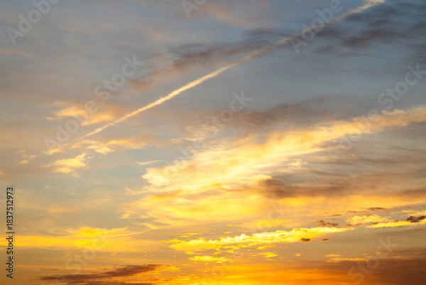Obraz Dramatic golden hour sky with vibrant clouds.