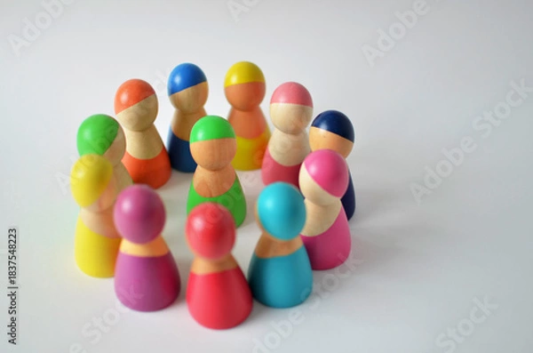 Obraz Diverse wooden figures forming a circle representing community