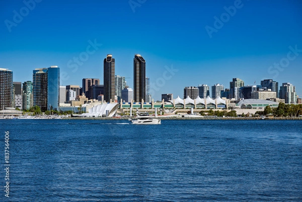 Obraz 2025-11-28 DOWNTOWN SAN DIEGO SKYLINE WITH THE CONVENTION CENTER AND THE RANY SHELL FROM CORANADO ISLAND WITH A NICE BLUE SKY