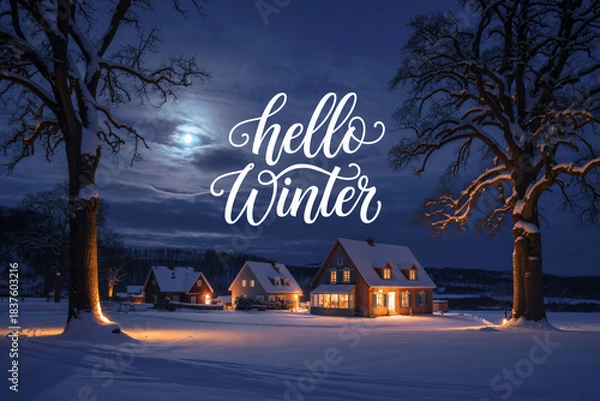 Obraz Cozy winter night scene with snow covered houses under a full moon and "hello winter" text overlay creating a peaceful holiday atmosphere at night.
