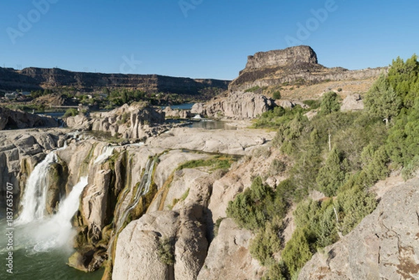 Fototapeta Aerial View of Gigantic Shoshone Waterfall and hydroelectric power plant, with the massive water cascading down into a serene pool in the Snake River. 
