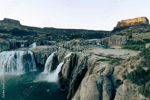 Fototapeta Aerial View of Gigantic Shoshone Waterfall and hydroelectric power plant, with the massive water cascading down into a serene pool in the Snake River. 