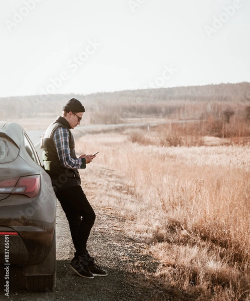 Obraz Hipster using smartphone