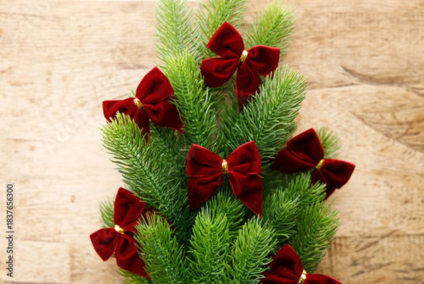 Obraz Red ribbons with pine branches, Christmas tree concept.