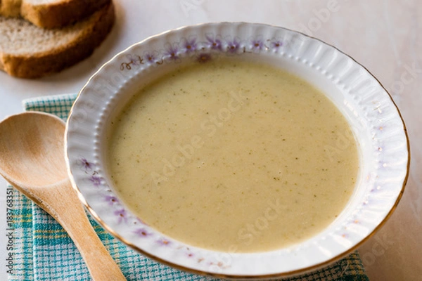 Fototapeta Broccoli Soup with Bread on Ceramic Surface.