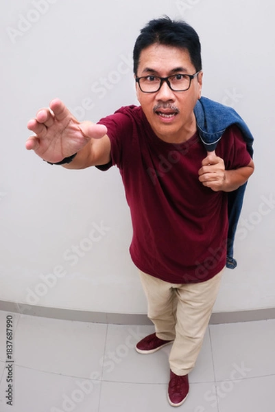 Fototapeta Top view shot of man reaching out with right hand