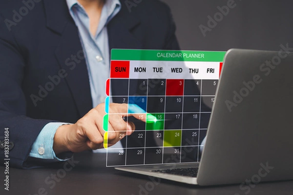 Obraz Businessman scheduling task on digital calendar interface.