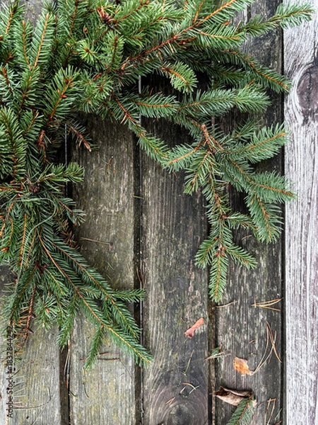Obraz Making rustic Christmas wreath. Moody Christmas image, holiday preparations. High quality photo