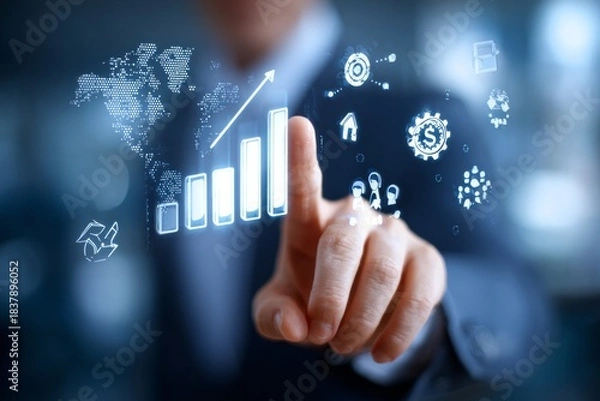 Fototapeta A man is pointing at a graph on a computer screen