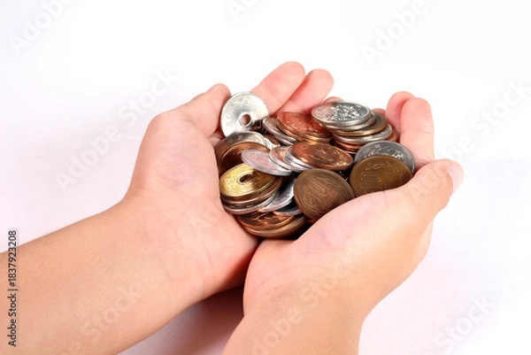 Obraz 小銭を持つ子どもの手