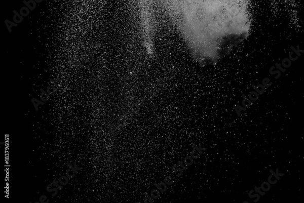 Obraz The falling white snow on a black background