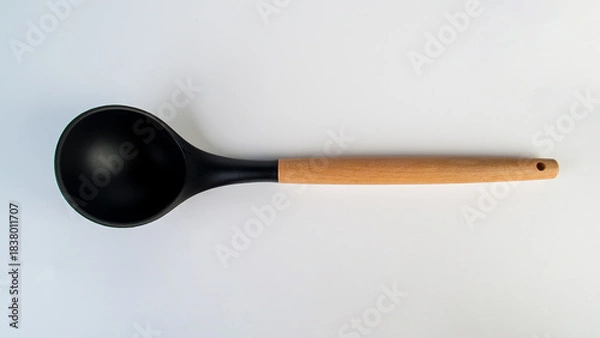 Fototapeta Black plastic spatula in hand on white background