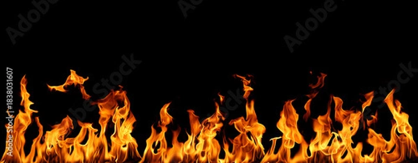 Fototapeta Realistic isolated fire flames on black background, perfect for digital design, photo compositing, visual effects, and creative projects requiring high-detail fiery textures and dynamic heat energy.