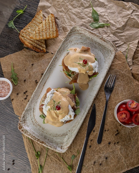 Fototapeta Eggs benedict with poached eggs