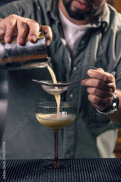 Fototapeta Professional bartender preparing a drink