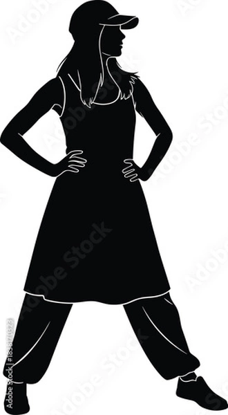 Obraz Strong, confident, and sporty woman silhouette standing with hands on hips, wearing a flowing dress over baggy trousers and a baseball cap, isolated black vector illustration.