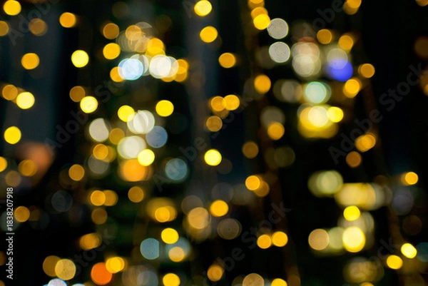 Obraz Blurry holiday background with yellow bubbles bokeh.