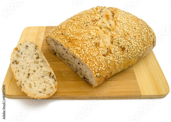 Fototapeta Sesame bread with different seeds and sliced isolated on white background