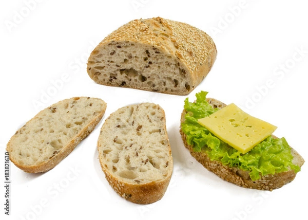 Fototapeta Sesame bread with different seeds and sliced isolated on white background