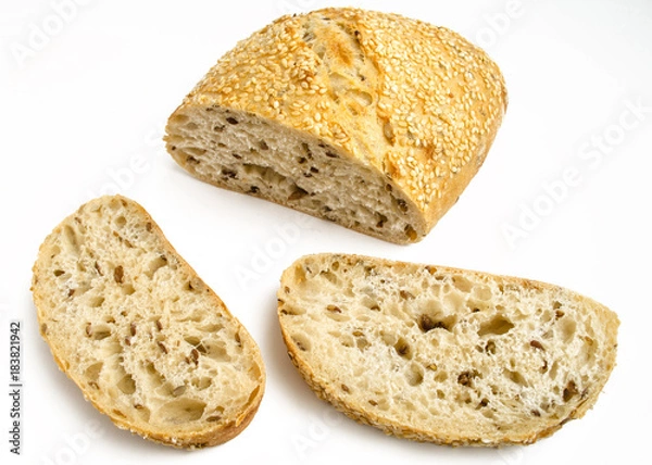 Fototapeta Sesame bread with different seeds and sliced isolated on white background