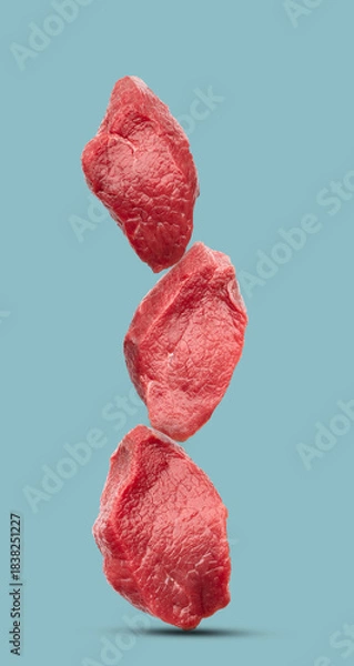 Obraz Raw filet mignon on blue background
