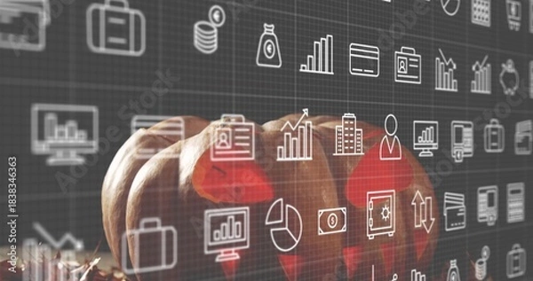 Obraz Displaying three small orange pumpkins resting on wooden tabletop with hay, digital finance icons