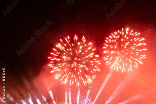 Fototapeta Red and white fireworks display at night