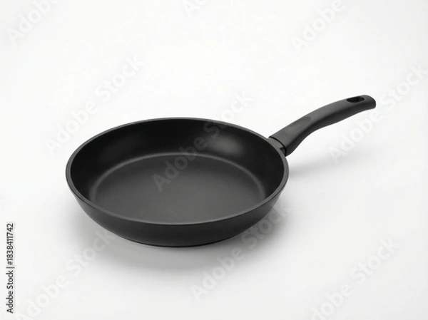 Fototapeta Modern matte black nonstick frying pan with an ergonomic black plastic handle isolated on a white background