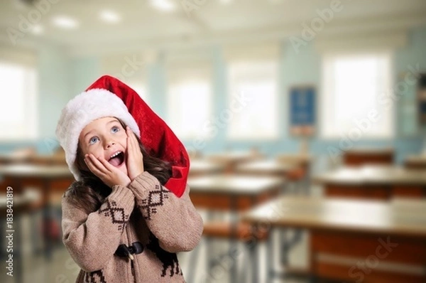 Fototapeta Portrait of beautiful little girl in santa hat