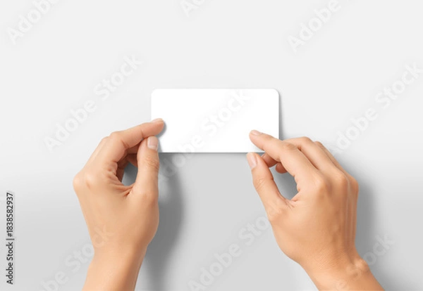Fototapeta Hands sticking white rectangle sticker, grey background, ai generated