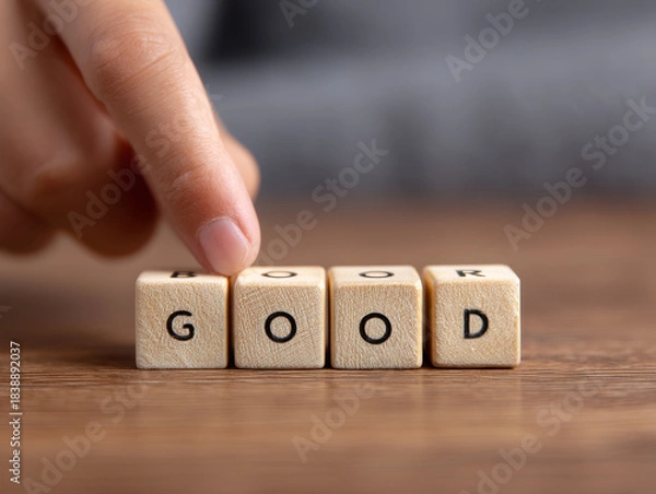 Fototapeta Good choice decision quality improvement change concept finger hand wooden cube block letter text word message option selection switch toggle transformation progress positive upgrade contrast