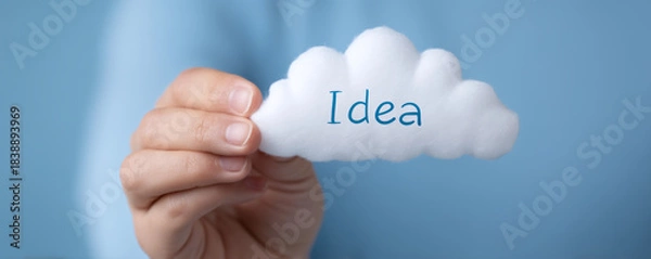 Fototapeta Idea concept cloud hand holding cloud blue background creativity symbol innovation message soft texture minimal design inspiration theme motivation concept startup idea