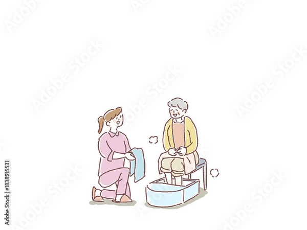 Obraz 足湯をする高齢女性とタオルを差し出す、看護師、介護士、ヘルパーの女性