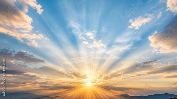 Obraz Radiant sunset over rooftop horizon with dramatic sunrays and warm clouds