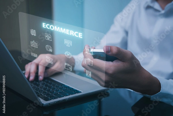 Obraz A person interacting with a laptop while displaying e-commerce icons and graphics, symbolizing digital commerce and technology integration.