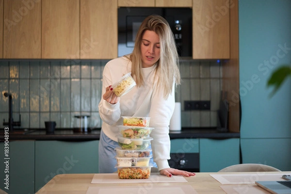 Obraz Checking Prepared Meal Above a Balanced Stack