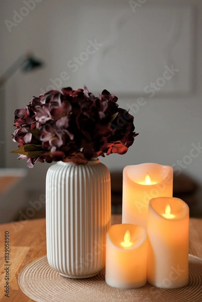 Obraz Cozy autumn home interior with warm candlelight and LED decor creating a calm hygge atmosphere
