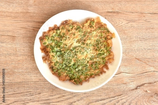 Fototapeta crispy fried egg omelets stuffed chop yard long bean Chinese food on dish  