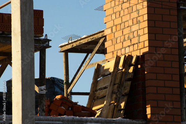 Fototapeta Detail of Brick Chimney or Wall Structure on an Unfinished Building Site