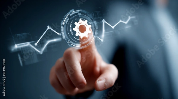 Obraz Businessman touching a digital screen with a graph and gear icon over a grey background