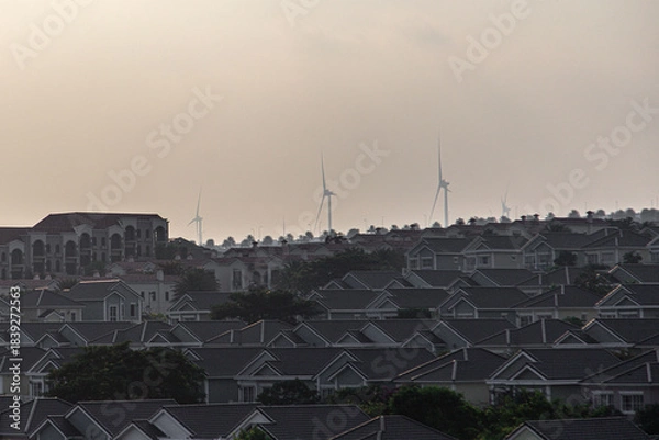 Obraz Wind turbines at cityscape