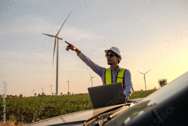 Fototapeta Engineer working at Wind turbine fields