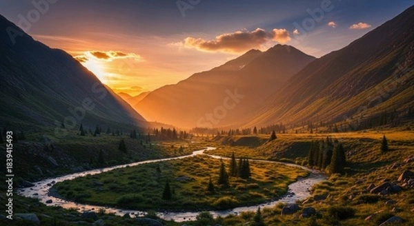 Fototapeta Majestic mountain valley basks in the warm glow of a setting sun