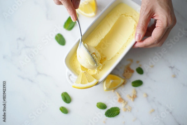 Fototapeta Ice cream with fruits mint lemon in a bowl on a plate