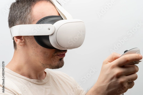 Obraz Man uses virtual reality headset side view